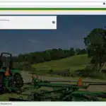 John Deere green tractor performing cotton harvesting in a rural field with trees in the background.