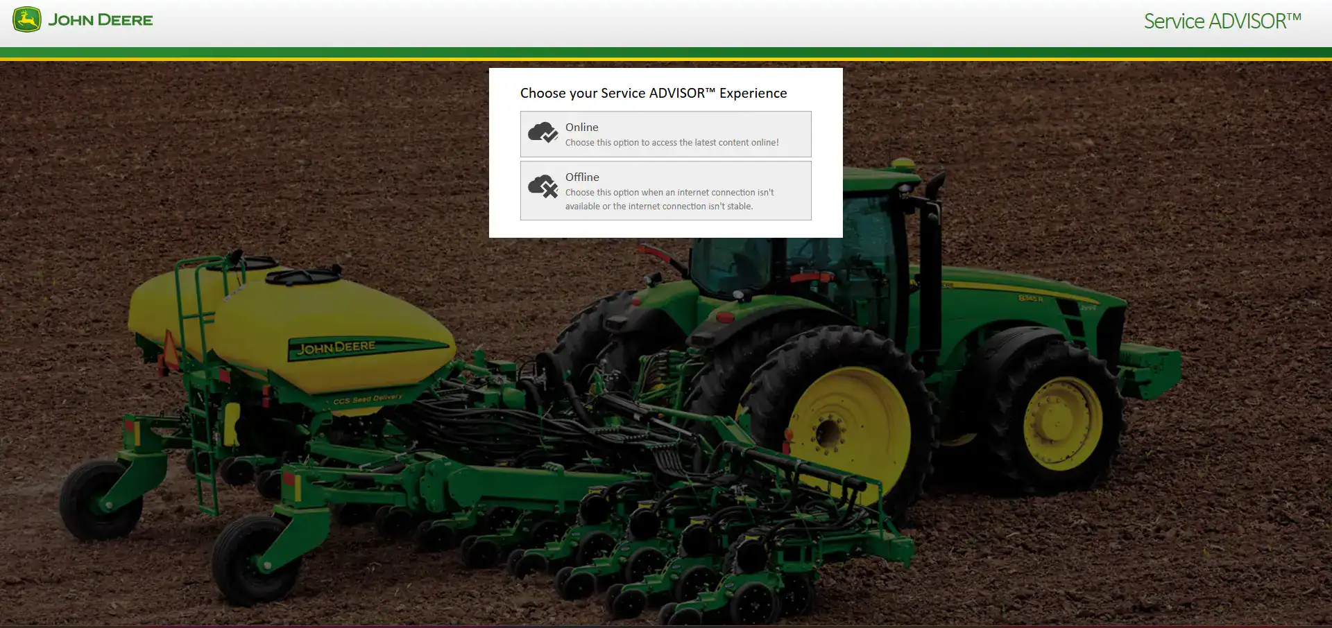 Green and yellow John Deere tractor with seed planter attachment on a farm field, demonstrating agricultural machinery for planting crops.