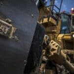 Heavy-duty Caterpillar bulldozer at a construction site, showcasing durable machinery for earthmoving and excavation projects. Perfect for infrastructure development and management.