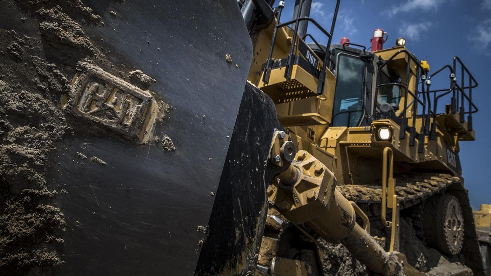 Heavy-duty Caterpillar bulldozer at a construction site, showcasing durable machinery for earthmoving and excavation projects. Perfect for infrastructure development and management.